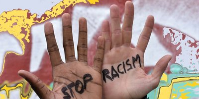 Hände mit der Aufschrift Stop Racism