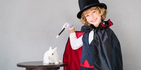 Child illusionist with cute rabbit